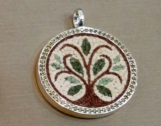 Mosaic pendant with a tree, framed in silver with green stones
