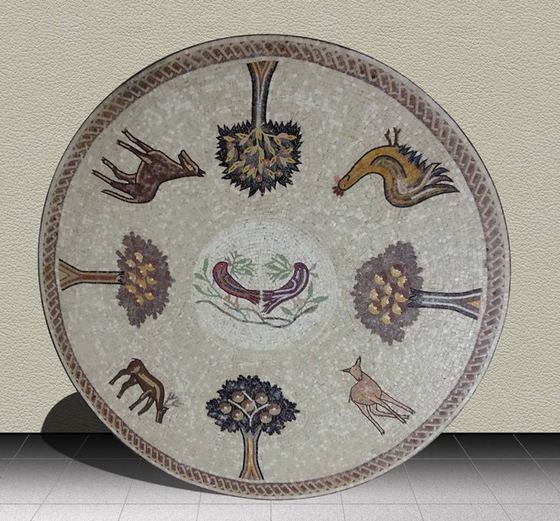 Round mosaic table top with trees and birds